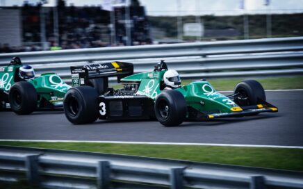 man riding on racing car